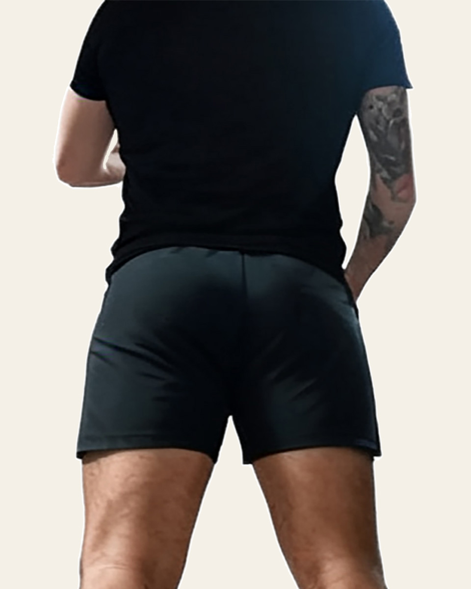 Athletic male posterior view illustrating structural limitations in gluteal projection